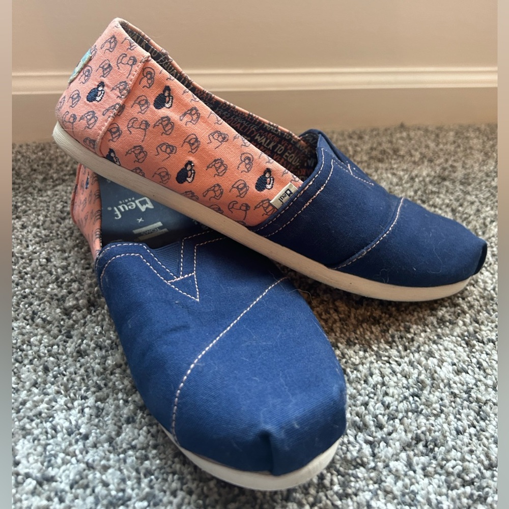 Toms “We Can Do It” Rosie the Riveter inspired shoes.  Worn a few times.